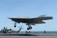 The X-47B unmanned combat air system (UCAS) demonstrator prepares to execute a touch-and-go landing