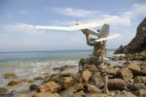 A U.S. soldier launches a Puma UAS