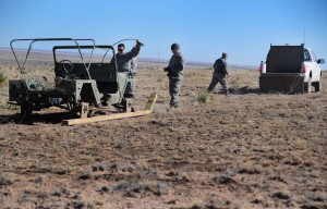 Ground crew attach a target to the unmanned vehicle