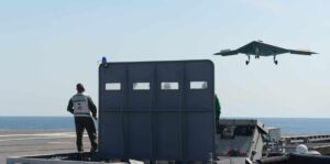 An X-47B unmanned combat air system (UCAS) demonstrator prepares to execute a touch and go landing on the flight deck of the aircraft carrier USS George H.W. Bush (CVN 77), marking the first time any unmanned aircraft has attempted a touch and go landing at sea. George H.W. Bush is conducting training operations in the Atlantic Ocean.