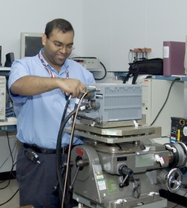 Kamal Joshi, an engineer at Northrop Grumman, tests the LN-100 inertial navigation system, which provides primary and backup navigation information for a variety of airborne and shipboard platforms.