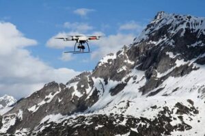 A microdrones GmbH md4-1000 drone flies over the Saint-Gotthard Massif