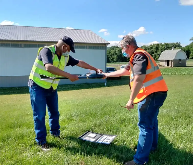 Peter Miller, certified Remote Pilot Instructor teaches student how to calibrate a MicaSense RedEdge multispectral camera on a SenseFly eBee X prior to launching an autonomous mission.