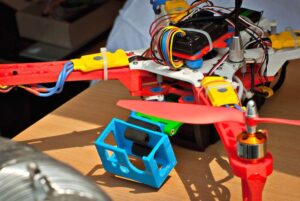 Elements of the drone, circuits and wires close up. The drone is made by myself. Multifunctional electronic devices at the children's scientific exhibition. Robotics and constructions.