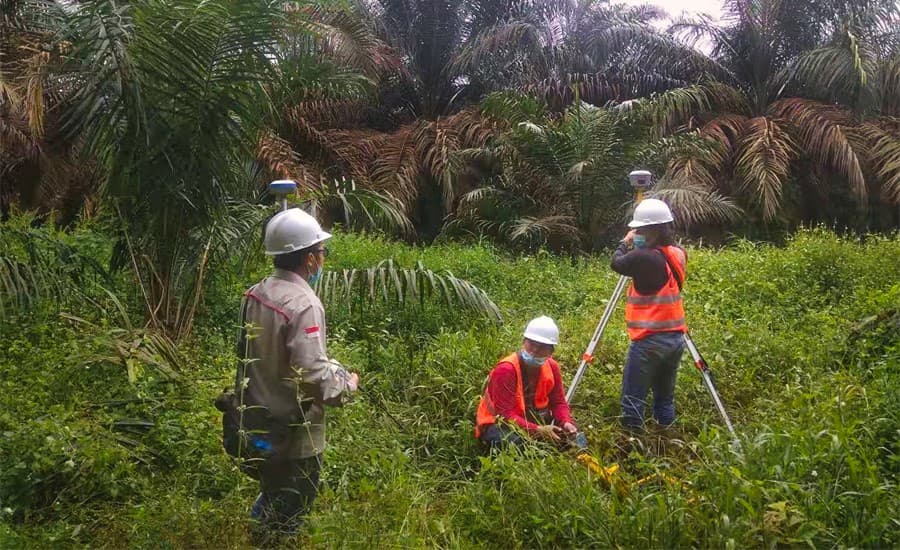 Figure 2. Setting up control points with CHCNAV GNSS receivers around a quarrying site in Indonesia.