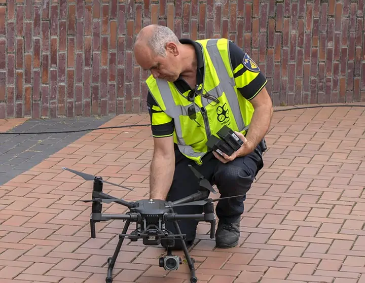 Police Man And Drone At Amsterdam The Netherlands