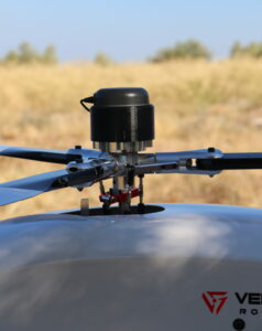 Unmanned helicopter with payload over rotor