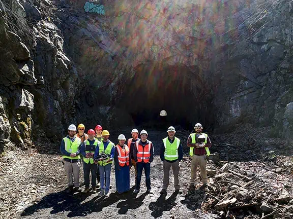 The full crew consisting of WarrenUAS students and staff and personnel from NJ Transit stand at the mouth of the tunnel.