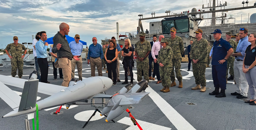 Vice Chief of Naval Operations Adm. Lisa Franchetti receives a briefing on PteroDynamics Transwing® UAV aboard the USNS Burlington