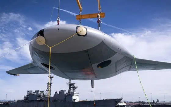 Extra Large UUV for Long-Duration Maritime Operations - image of a large UUV being lifted by a crane for transport.